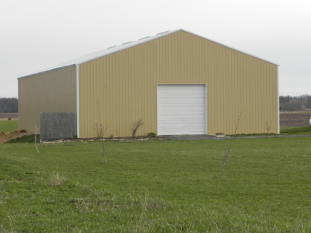 3392 Dredge Road Paw Paw, IL 61353 - Photo 15 of 18 a house is sitting in middle of the green field