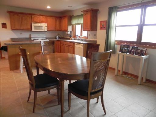 3392 Dredge Road Paw Paw, IL 61353 - Photo 8 of 18 a dining table with chairs and window