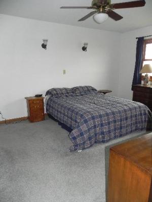3392 Dredge Road Paw Paw, IL 61353 - Photo 9 of 18 a bedroom with bed and window