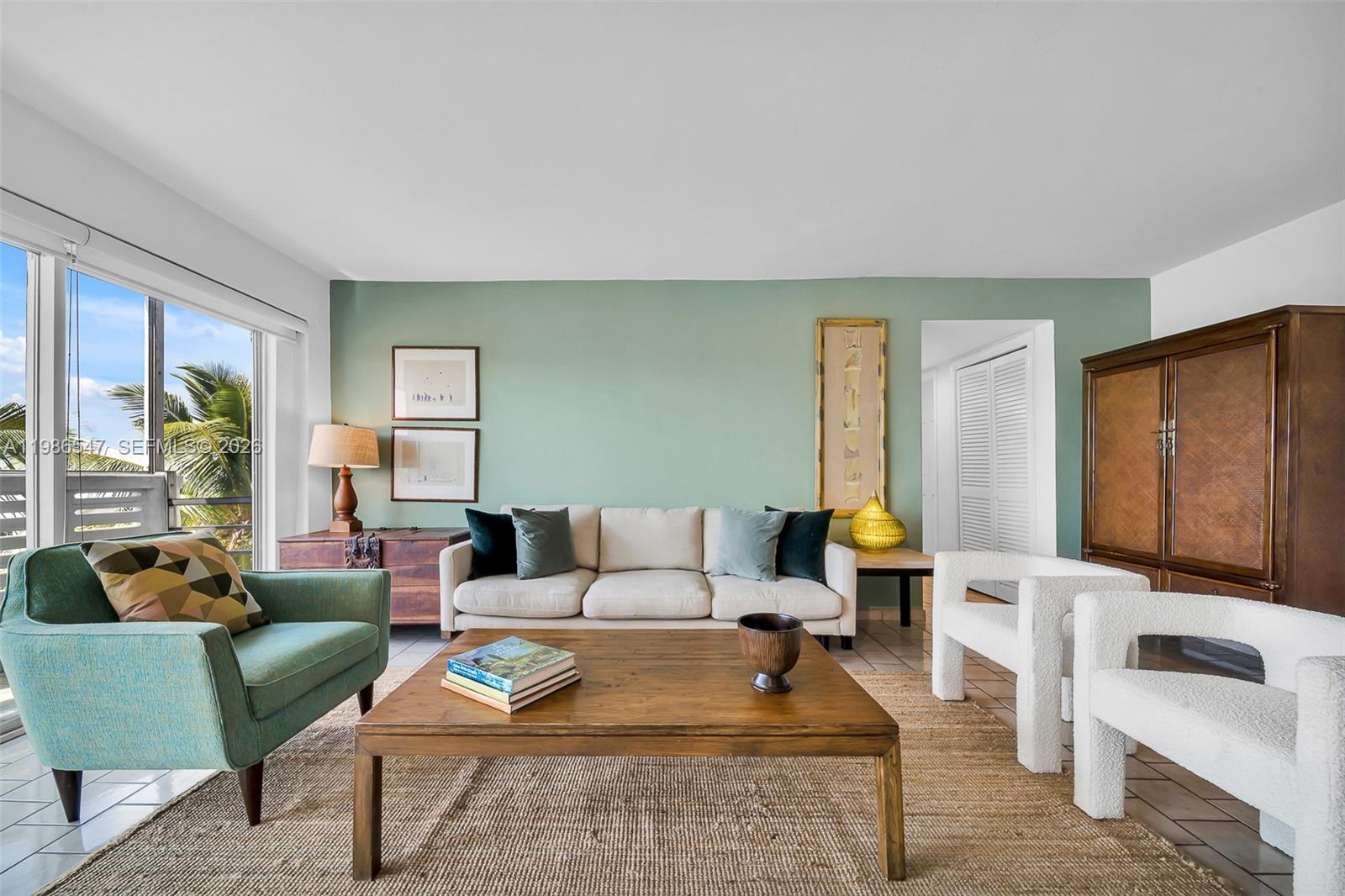 a living room with furniture and a large window