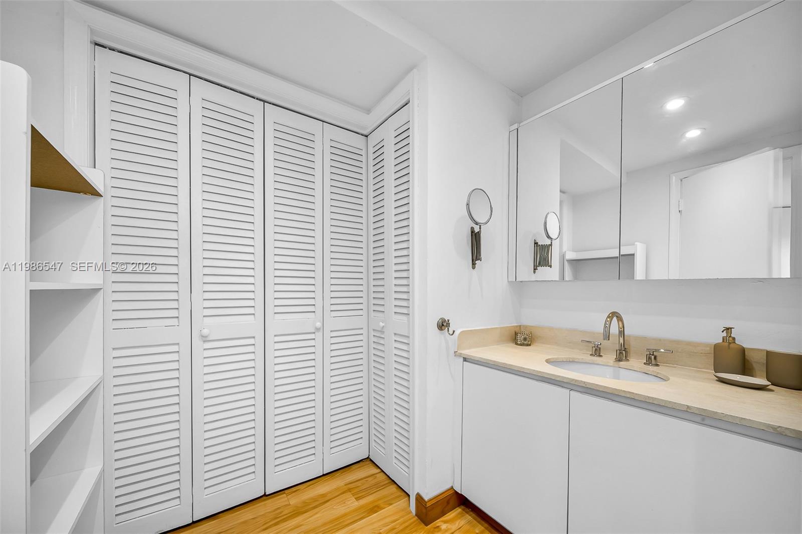 555 Crandon Boulevard, Unit 53 Key Biscayne, FL 33149 - Photo 12 of 23 a kitchen with a sink and cabinets