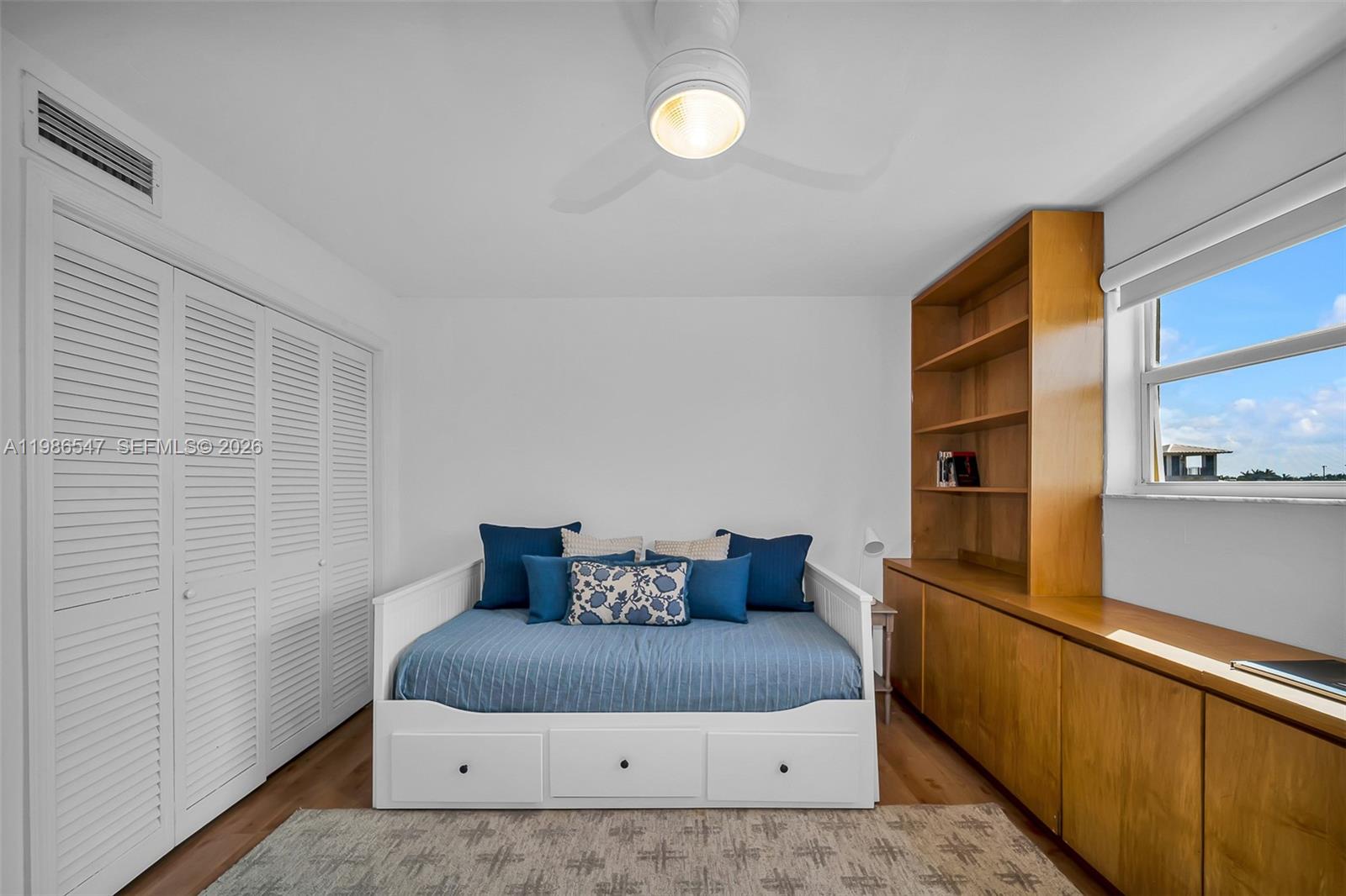 555 Crandon Boulevard, Unit 53 Key Biscayne, FL 33149 - Photo 14 of 23 a bedroom with a bed and wooden floor