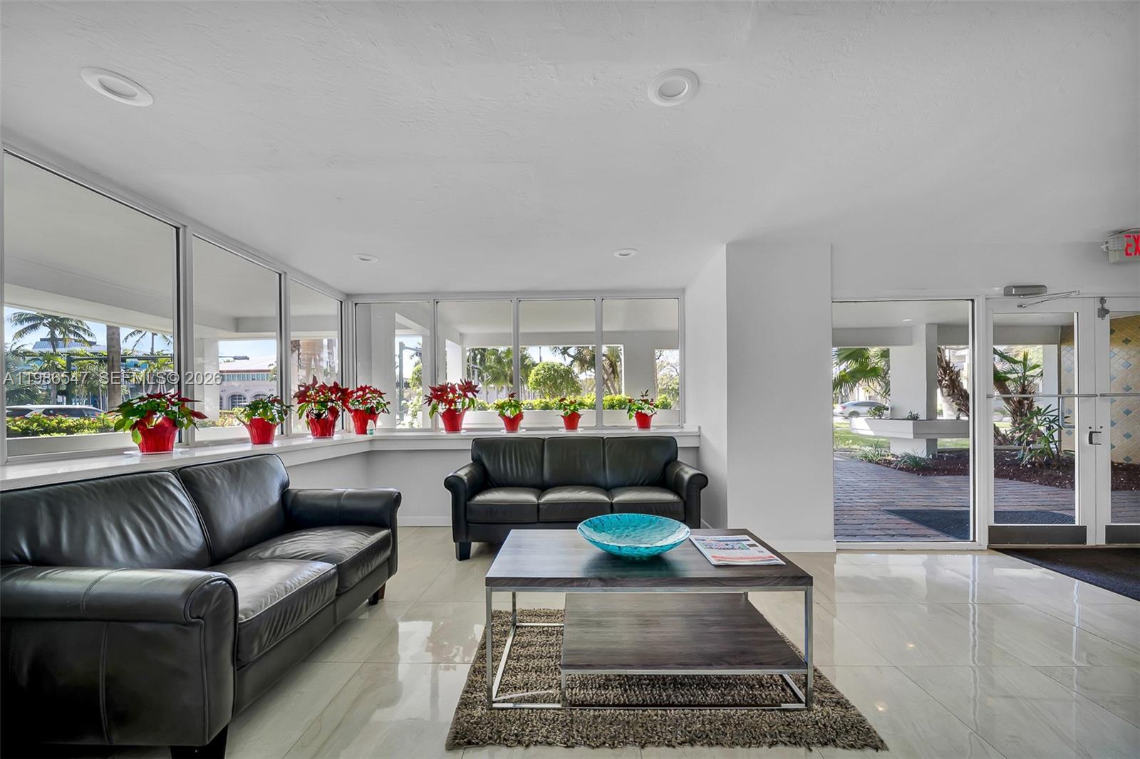 555 Crandon Boulevard, Unit 53 Key Biscayne, FL 33149 - Photo 15 of 23 a living room with furniture and a rug
