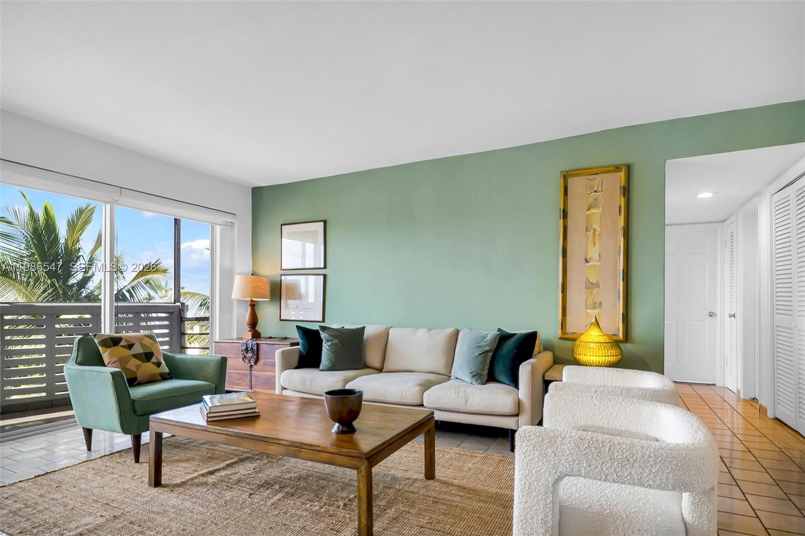 555 Crandon Boulevard, Unit 53 Key Biscayne, FL 33149 - Photo 2 of 23 a living room with furniture and a large window