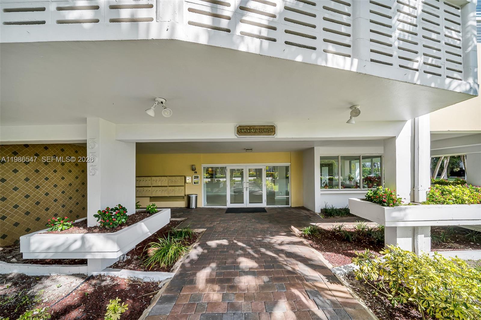 555 Crandon Boulevard, Unit 53 Key Biscayne, FL 33149 - Photo 22 of 23 a front view of a house with outdoor seating