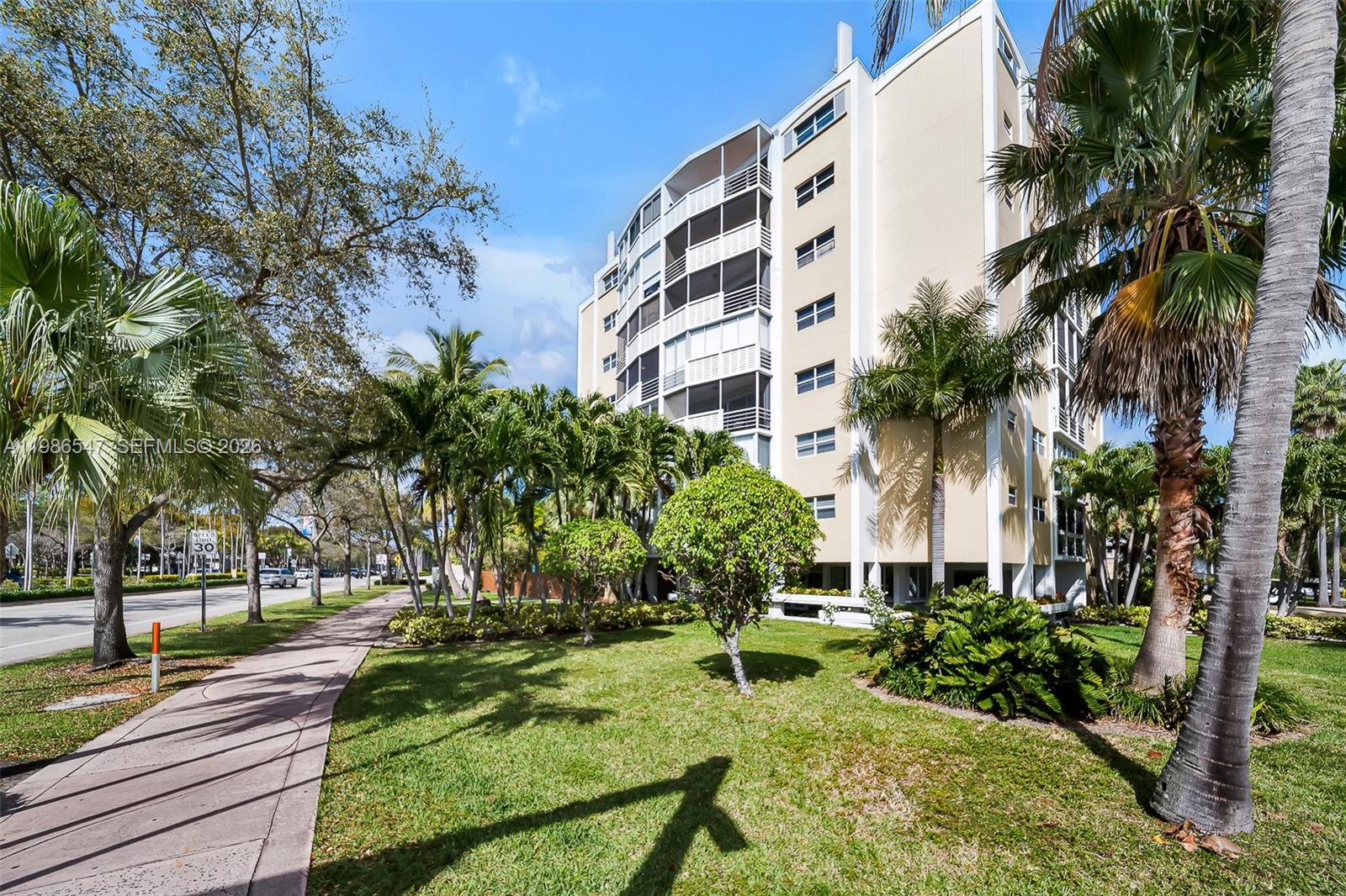 555 Crandon Boulevard, Unit 53 Key Biscayne, FL 33149 - Photo 23 of 23 a view of a yard with plants and palm trees