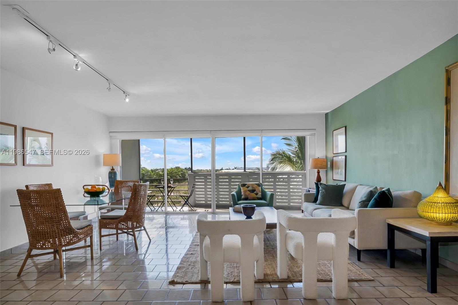 555 Crandon Boulevard, Unit 53 Key Biscayne, FL 33149 - Photo 5 of 23 a living room with furniture and a large window