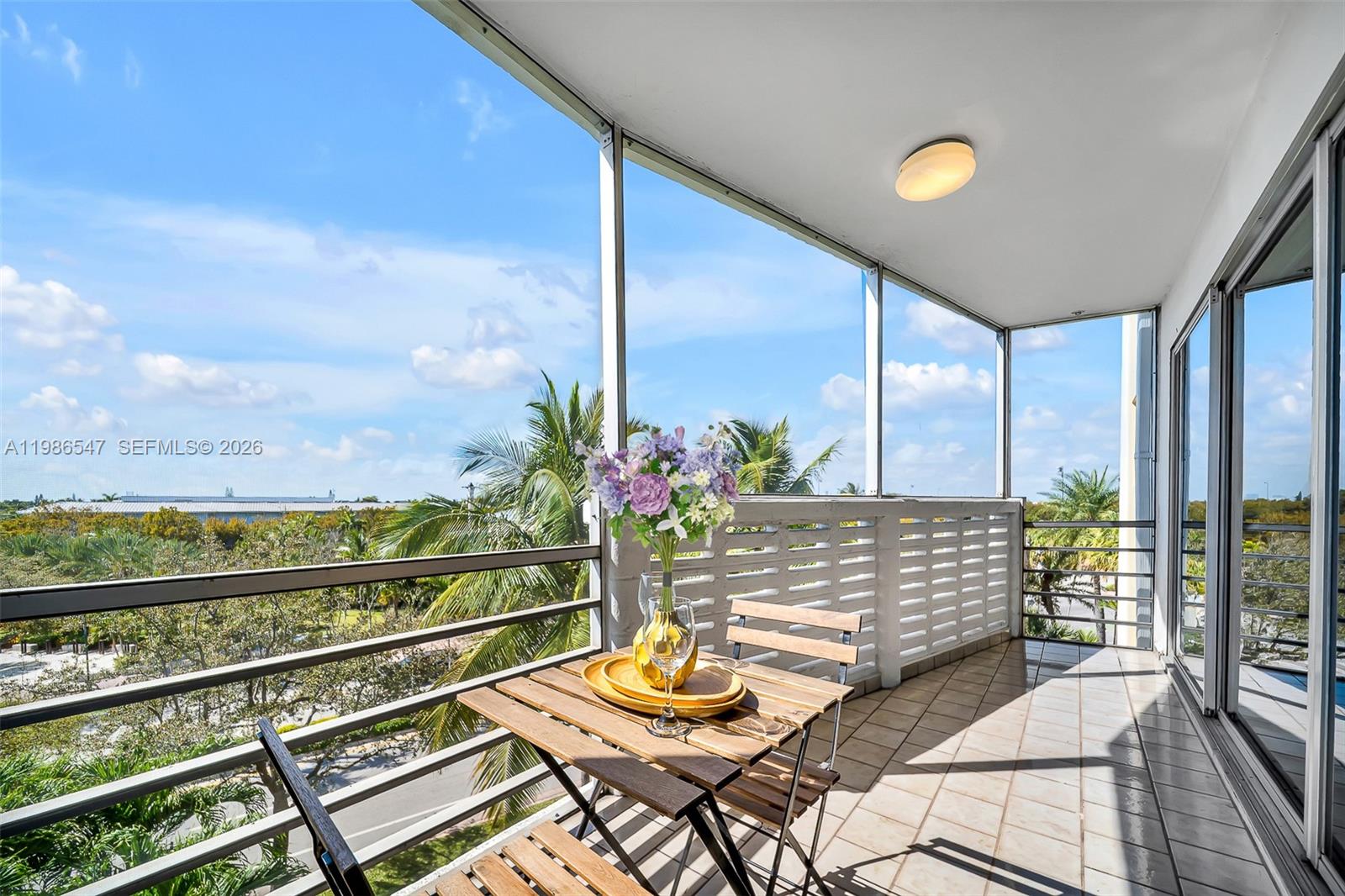 555 Crandon Boulevard, Unit 53 Key Biscayne, FL 33149 - Photo 6 of 23 a view of an outdoor space with seating area