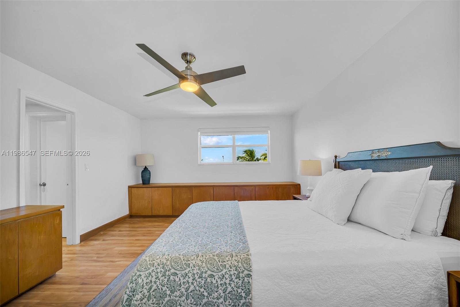 555 Crandon Boulevard, Unit 53 Key Biscayne, FL 33149 - Photo 10 of 23 a bedroom with a bed and painting on the wall