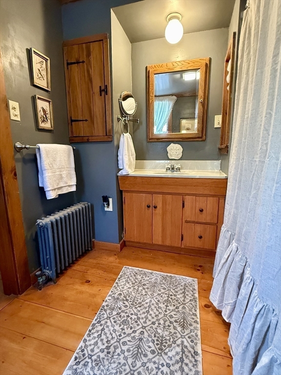 285 Brookfield Road Sturbridge, MA 01518 - Photo 20 of 42 a bedroom with a bed and a dresser