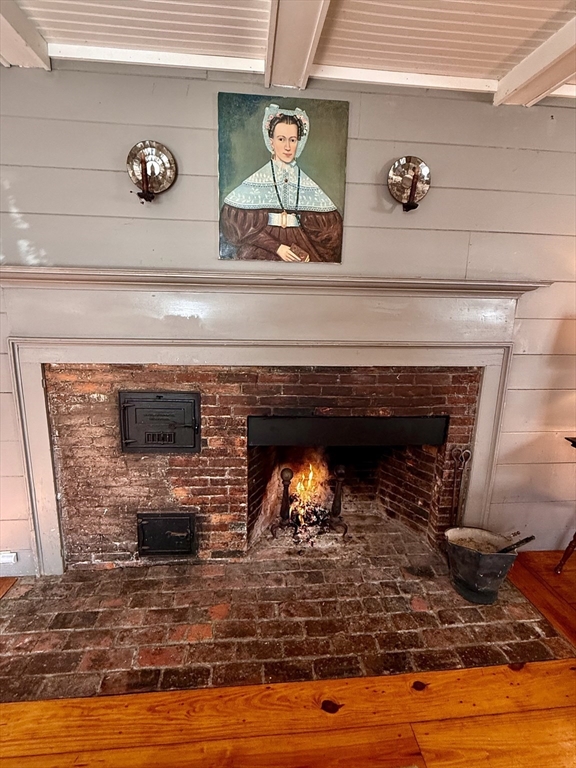 285 Brookfield Road Sturbridge, MA 01518 - Photo 2 of 42 a fireplace with a clock on wall