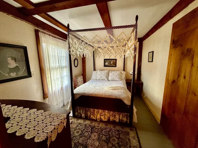 a view of a hallway with paintings on the wall