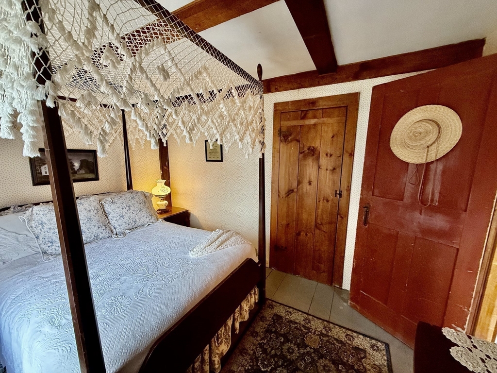 285 Brookfield Road Sturbridge, MA 01518 - Photo 23 of 42 a view of a hallway with paintings on the wall