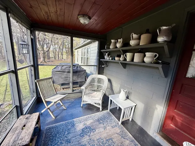 a room with lots of books and chairs