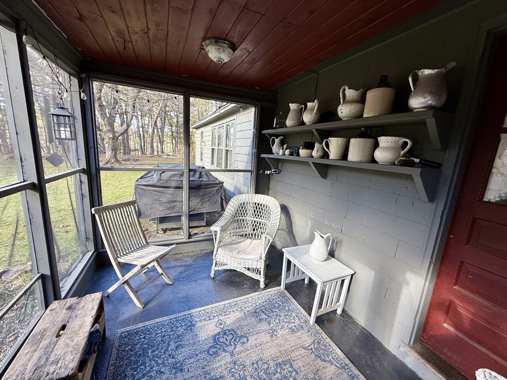 285 Brookfield Road Sturbridge, MA 01518 - Photo 33 of 42 a living room with furniture and a wooden floor