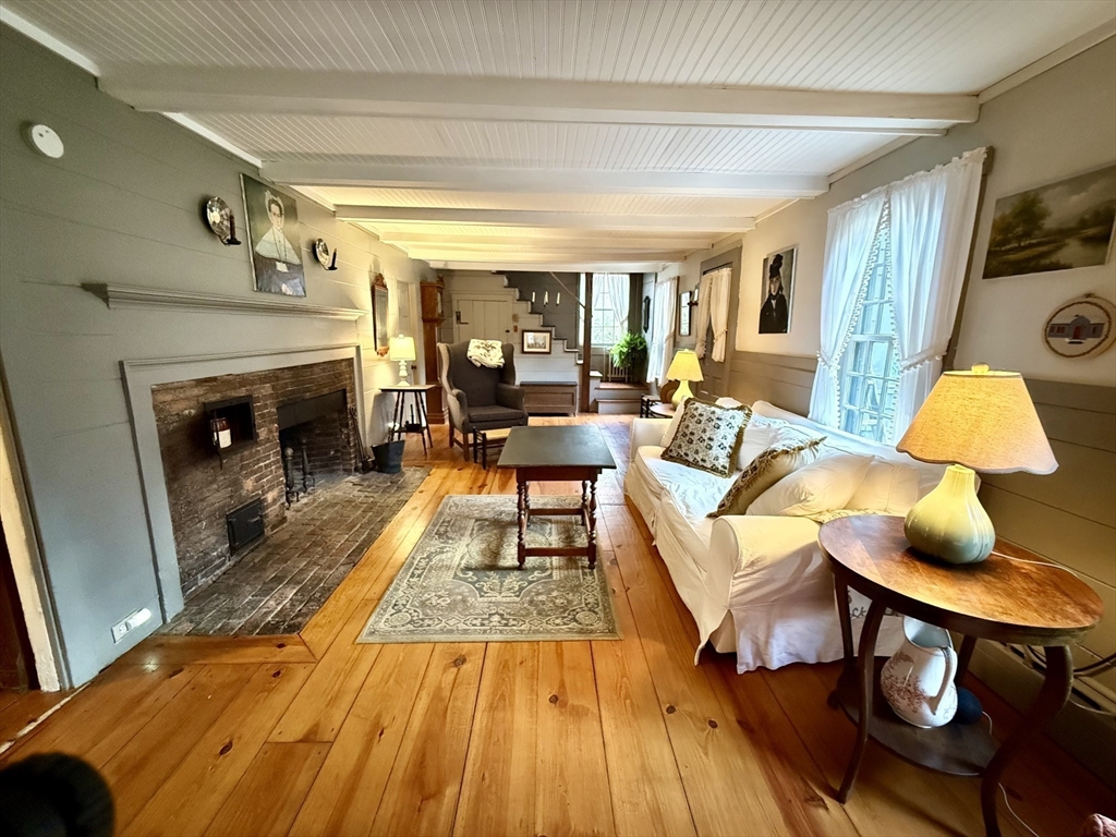 285 Brookfield Road Sturbridge, MA 01518 - Photo 6 of 42 a living room with furniture and a fireplace