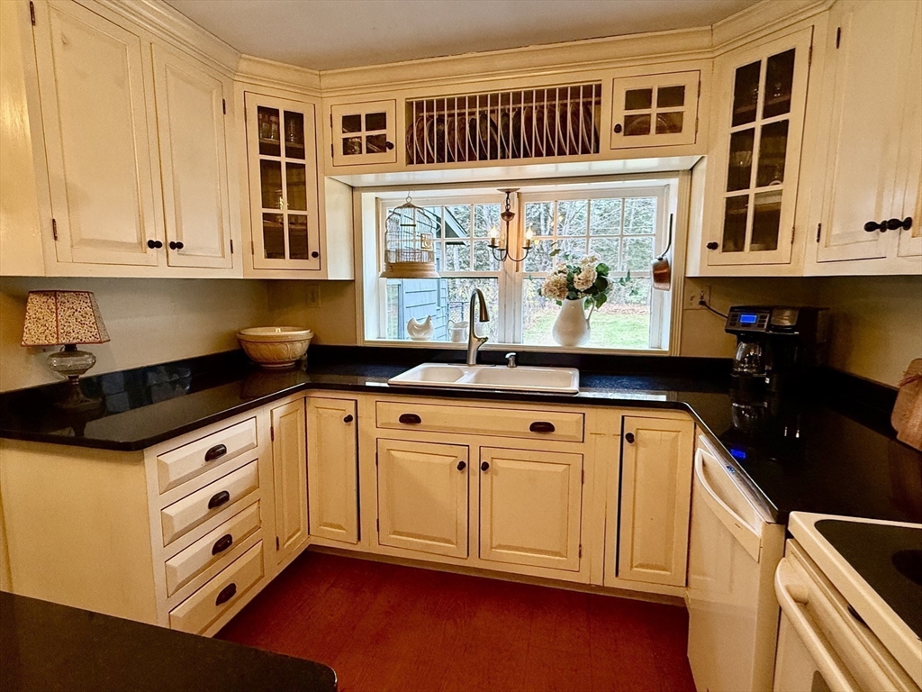 285 Brookfield Road Sturbridge, MA 01518 - Photo 9 of 42 a kitchen with stainless steel appliances granite countertop a sink and cabinets