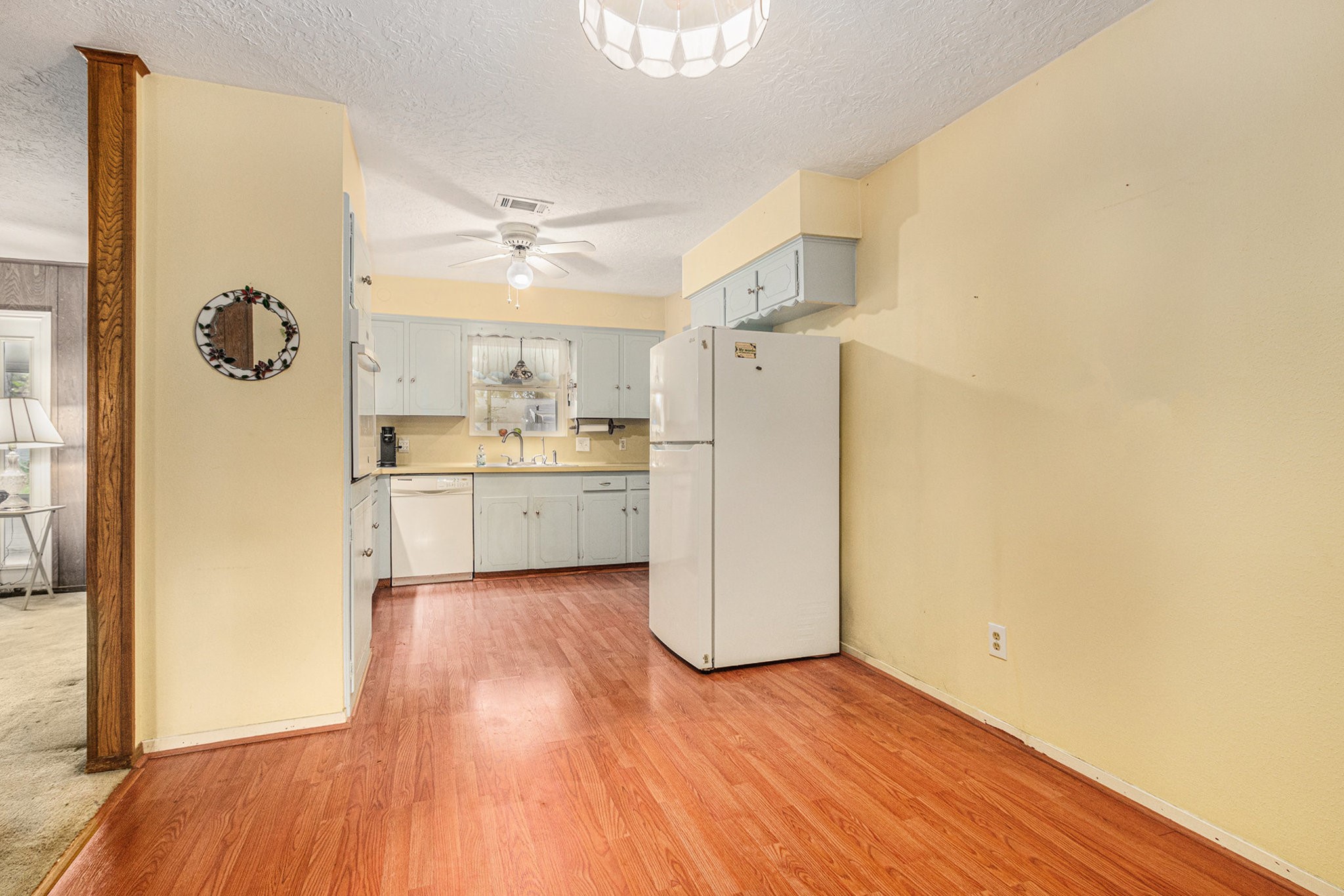 8019 Sharpview Drive Houston, TX 77036 - Photo 13 of 40 Family room on your left, kitchen straight ahead. Refrigerator can stay