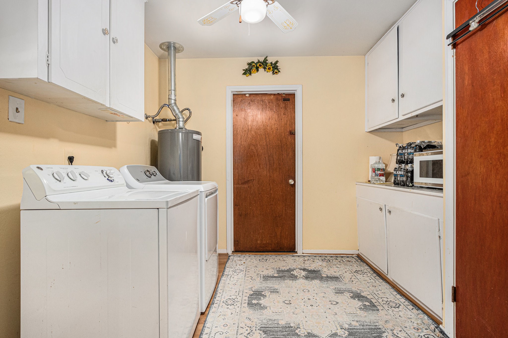 8019 Sharpview Drive Houston, TX 77036 - Photo 14 of 40 Utility room off kitchen. Washer and dryer can stay, Look at all the storage!
