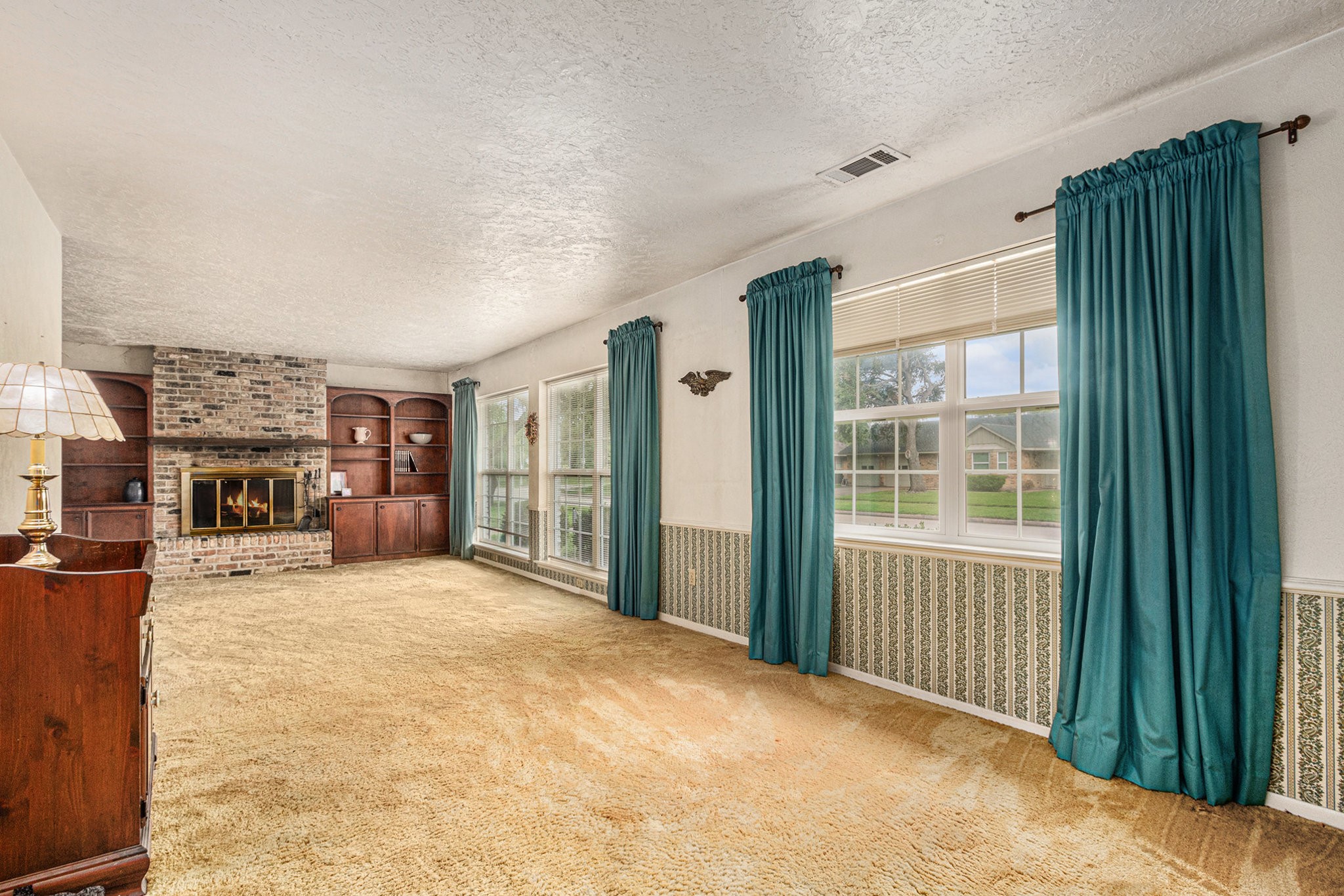 8019 Sharpview Drive Houston, TX 77036 - Photo 5 of 40 To your right is a massive family room. At some point the garage was taken in to make great living space. Large windows for lots of natural light