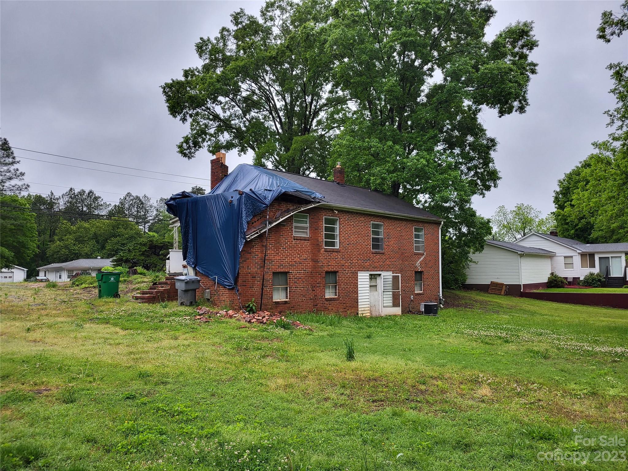 708 Tom Sadler Road Charlotte, NC 28214 - Photo 15 of 16 a view of a house with a yard and sitting area