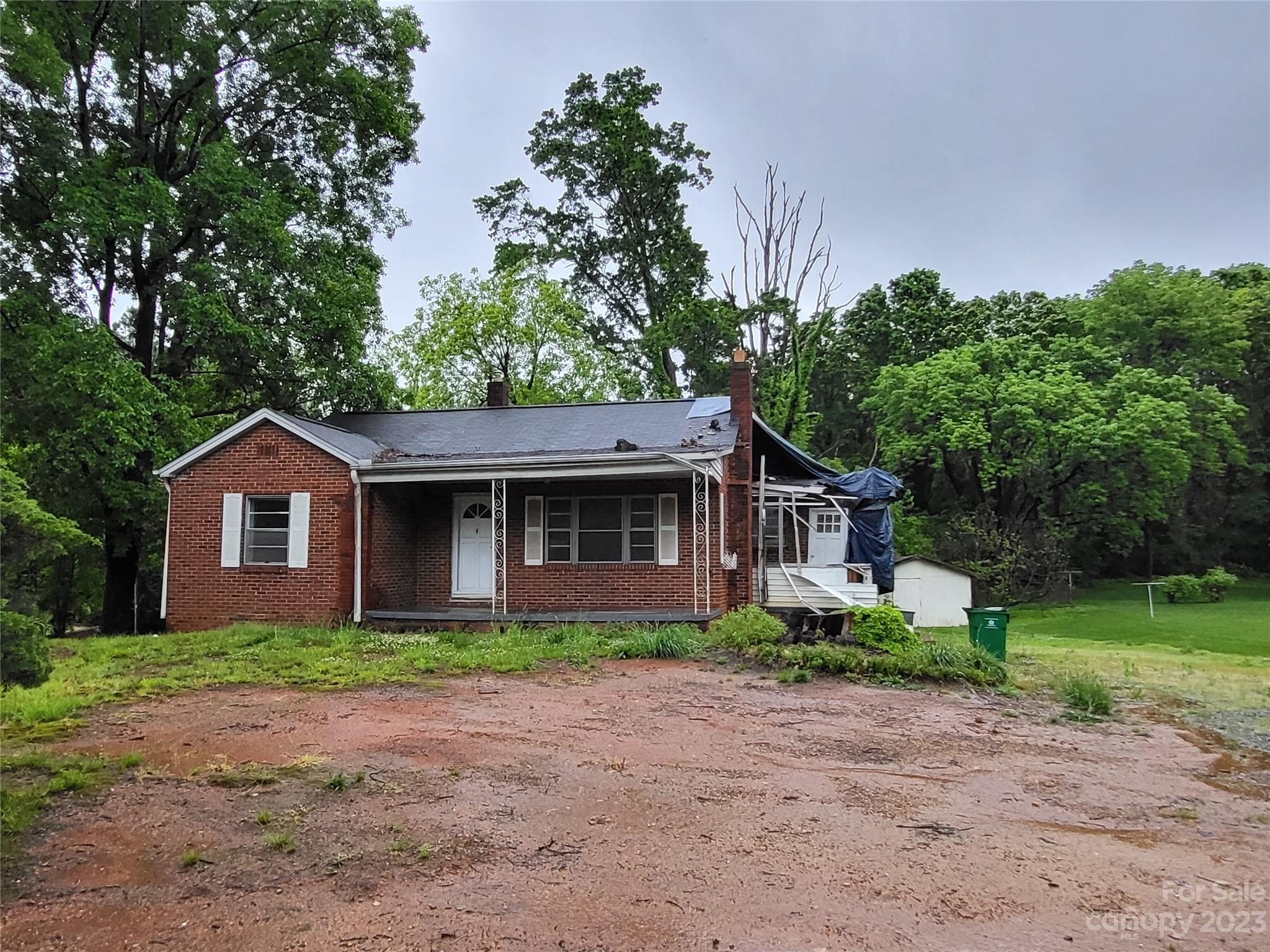 708 Tom Sadler Road Charlotte, NC 28214 - Photo 2 of 16 a front view of house with yard and trees