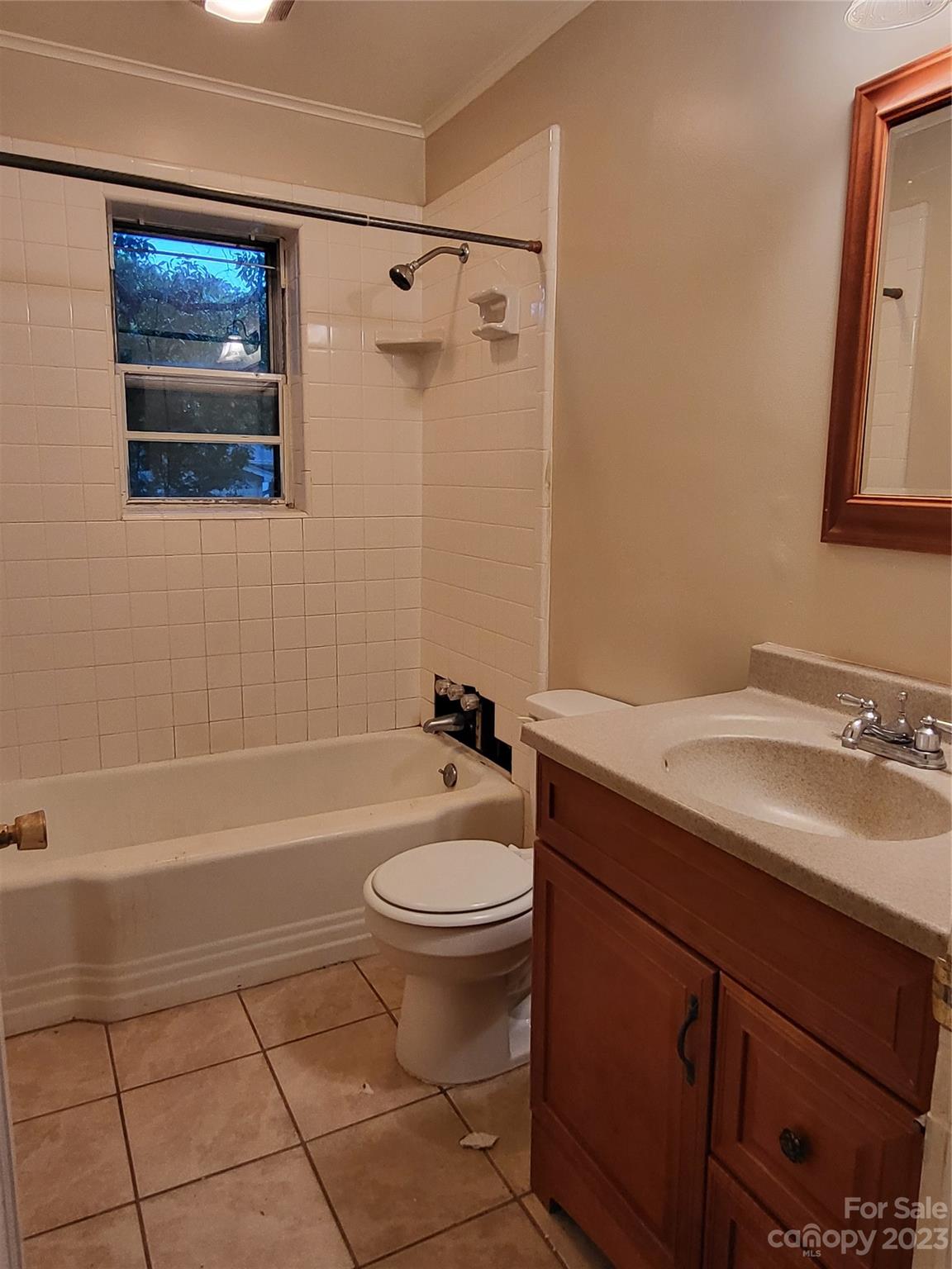 708 Tom Sadler Road Charlotte, NC 28214 - Photo 7 of 16 a bathroom with a sink a toilet and shower