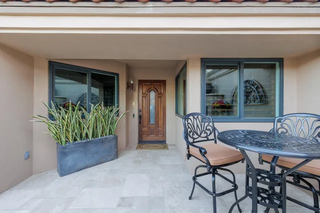 a living room with fireplace furniture and a flat screen tv