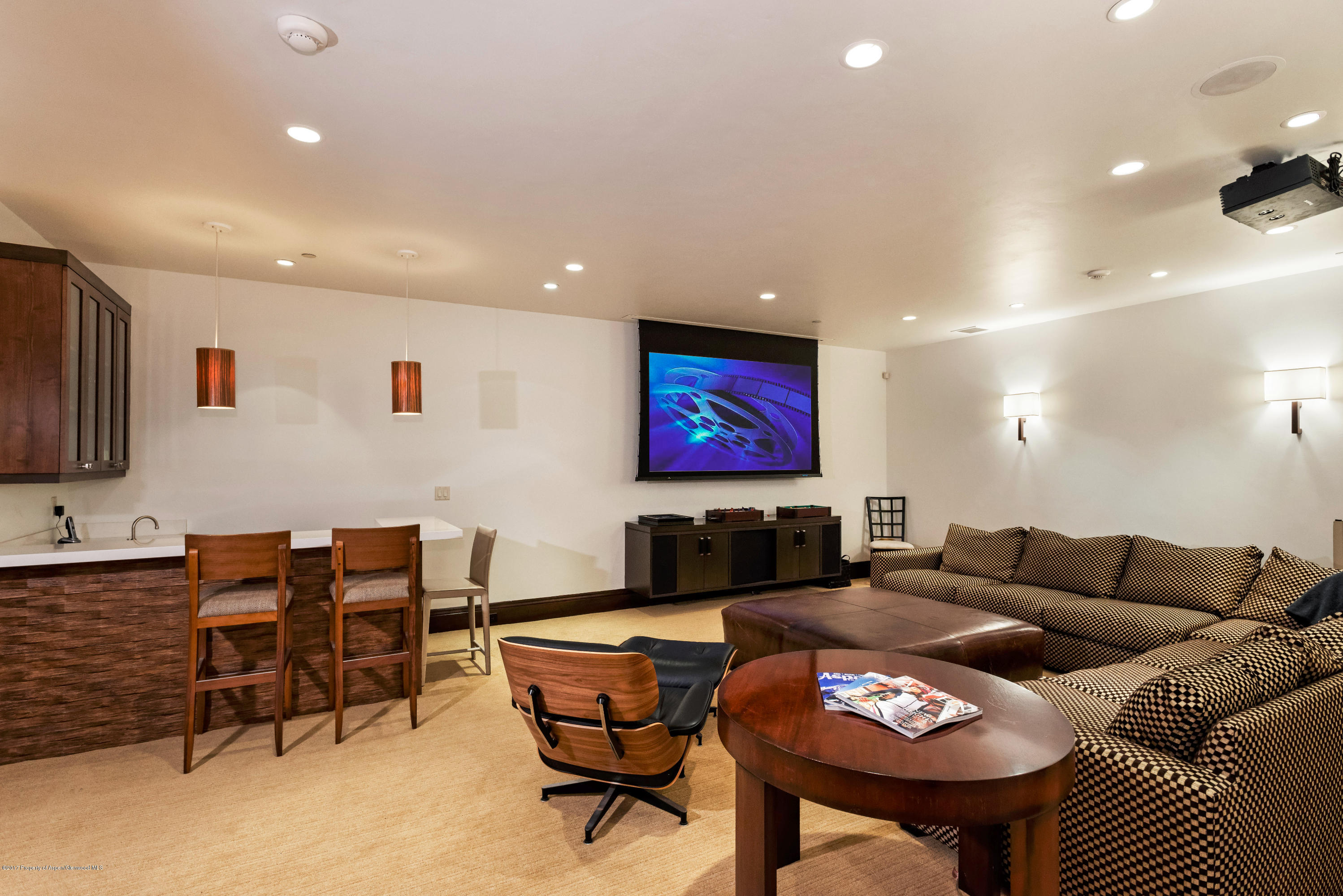 566 Race Street Aspen, CO 81611 - Photo 18 of 26 a living room with furniture and a flat screen tv
