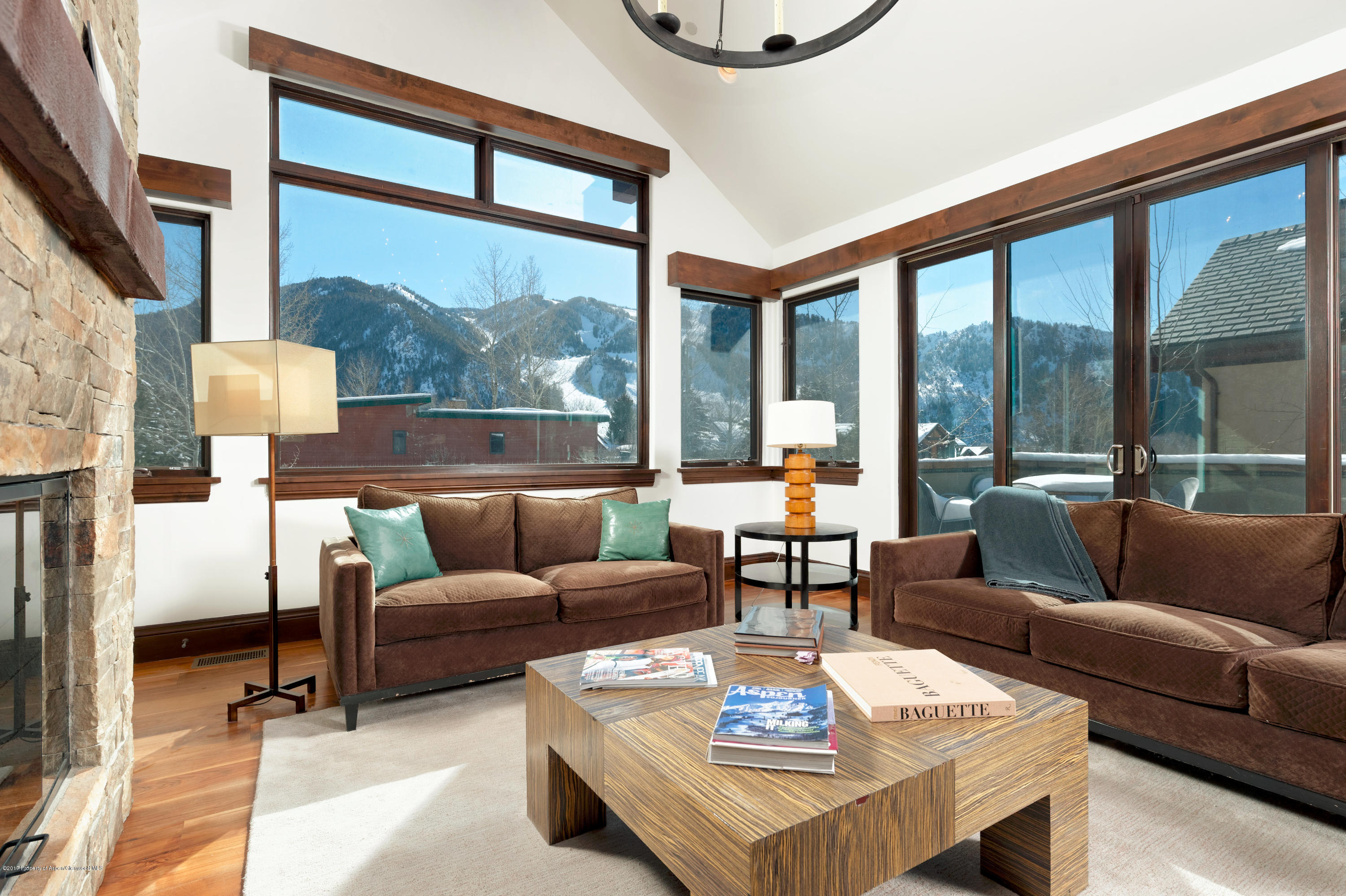 566 Race Street Aspen, CO 81611 - Photo 4 of 26 a living room with furniture a large window and a table