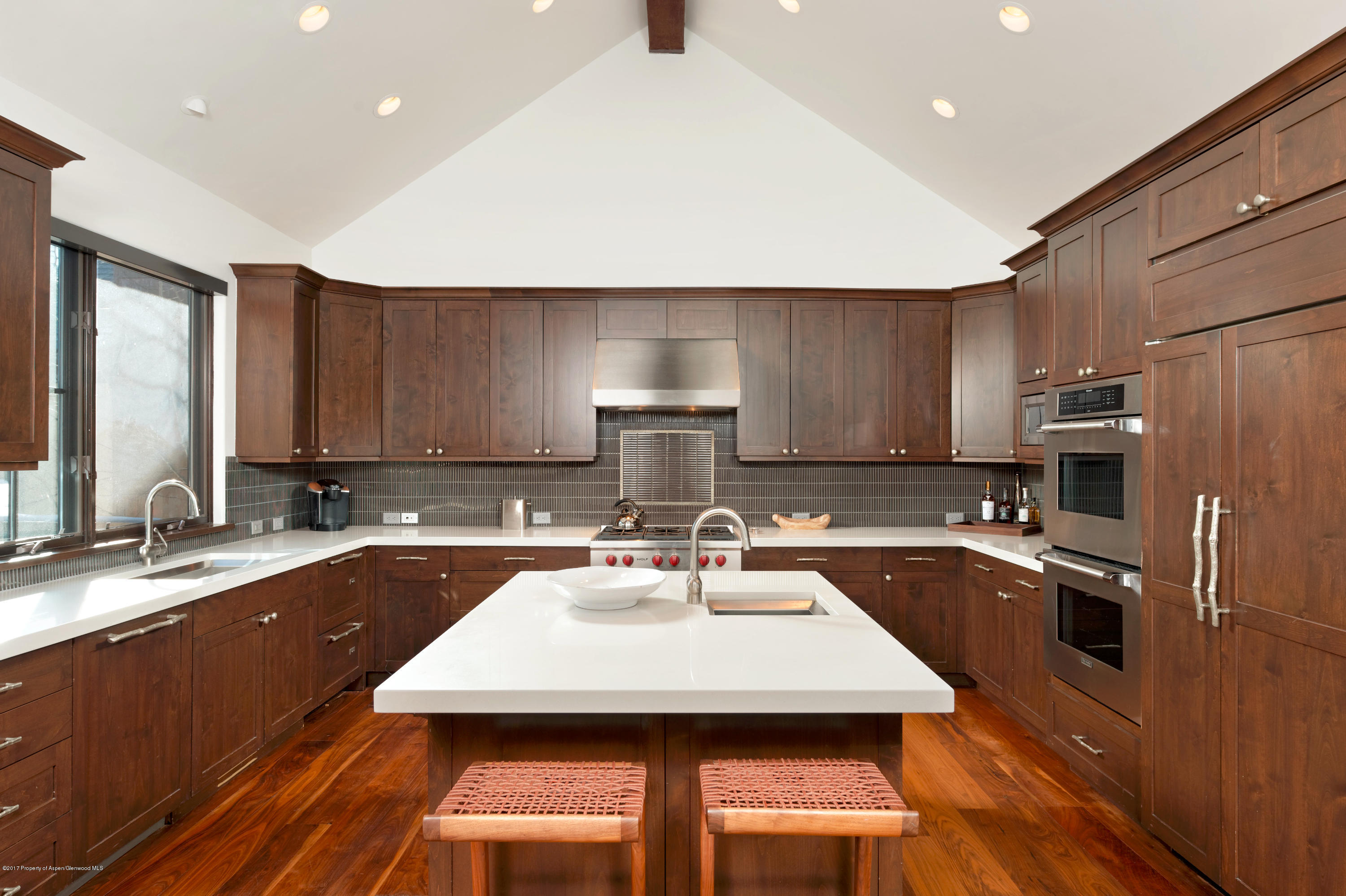 566 Race Street Aspen, CO 81611 - Photo 7 of 26 a kitchen with a sink a stove a refrigerator and a cabinets