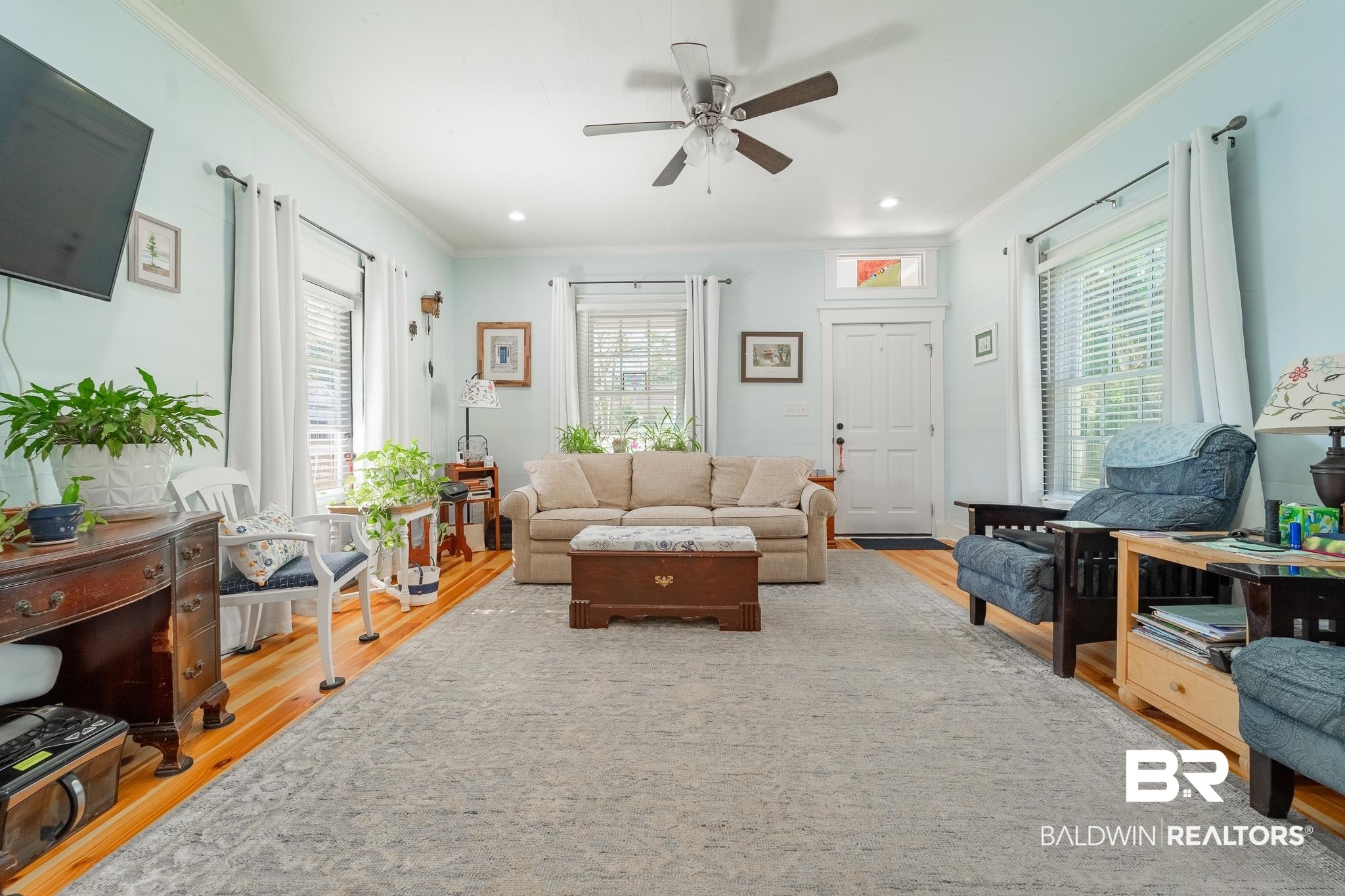 950 Texas Street Mobile, AL 36604 - Photo 5 of 17 Living room featuring ceiling fan, light hardwood / wood-style flooring, and ornamental molding