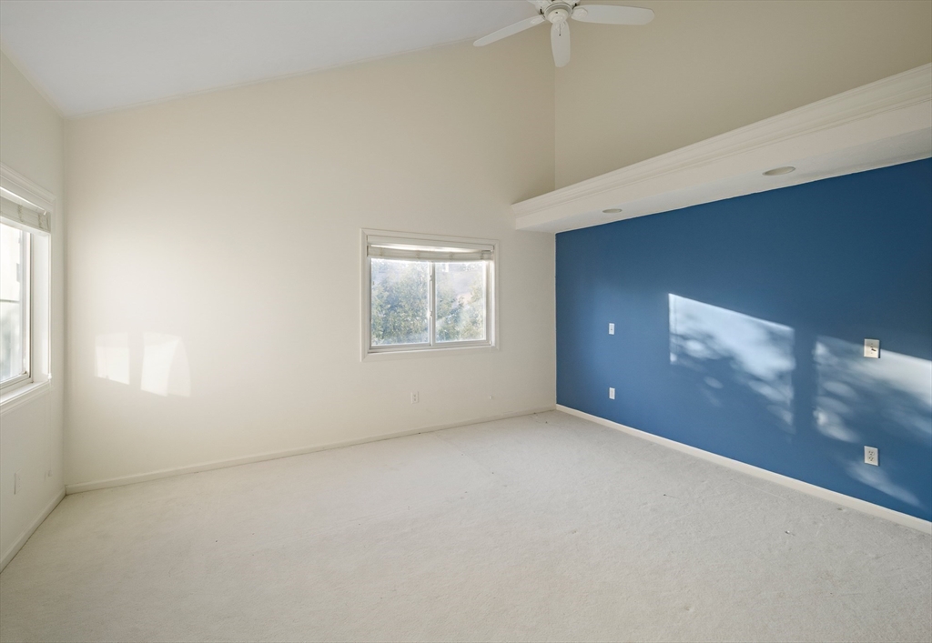 73 Half Crown Circle, Unit 73 Ashland, MA 01721 - Photo 15 of 25 an empty room with windows and closet