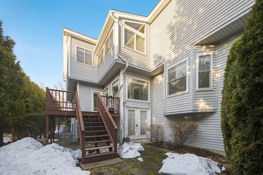73 Half Crown Circle, Unit 73 Ashland, MA 01721 - Photo 24 of 25 a front view of a house with stairs