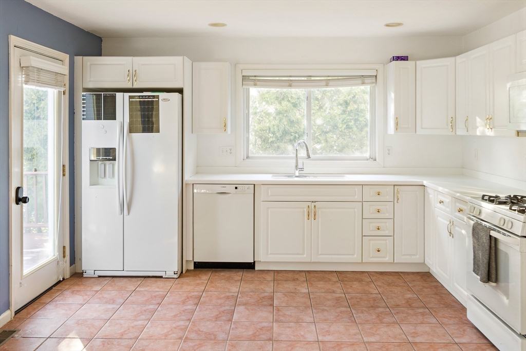 73 Half Crown Circle, Unit 73 Ashland, MA 01721 - Photo 3 of 25 a kitchen with stainless steel appliances a stove sink and refrigerator