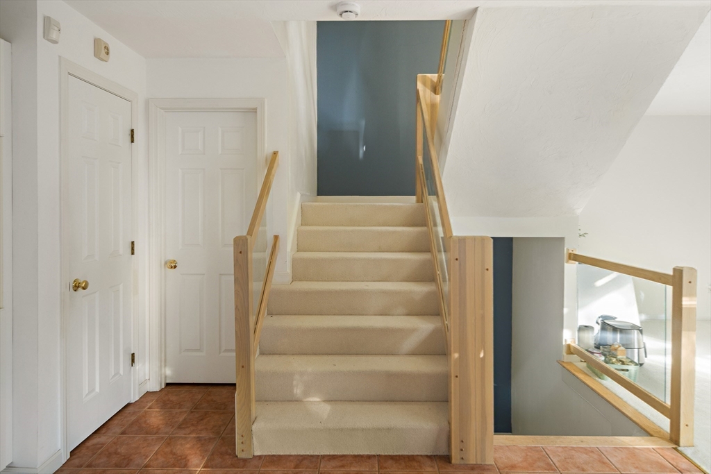 73 Half Crown Circle, Unit 73 Ashland, MA 01721 - Photo 9 of 25 a view of an entryway with wooden floor