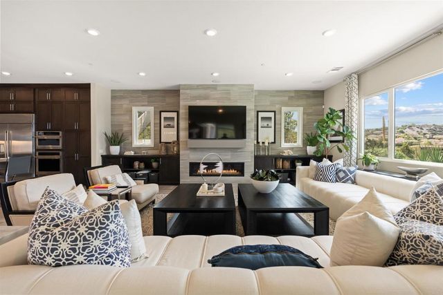 a kitchen with a sink and dishwasher a stove top oven with wooden floor