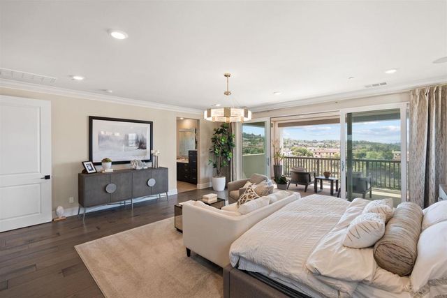 a living room with furniture and a lamp