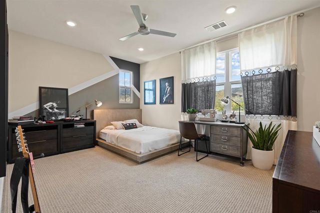 a front view of a house with yard and green space