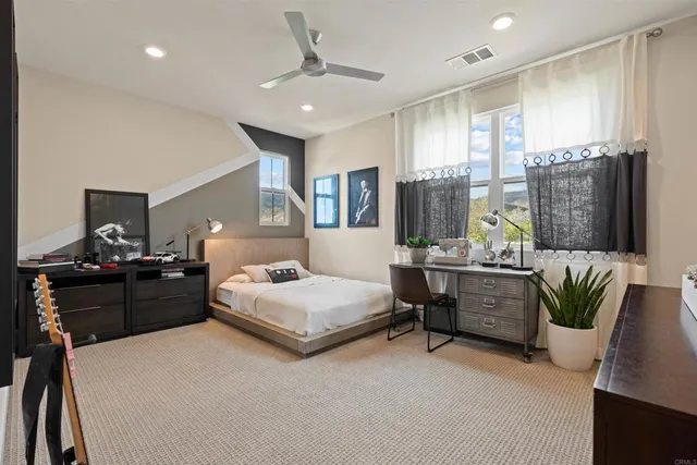 a front view of a house with yard and green space