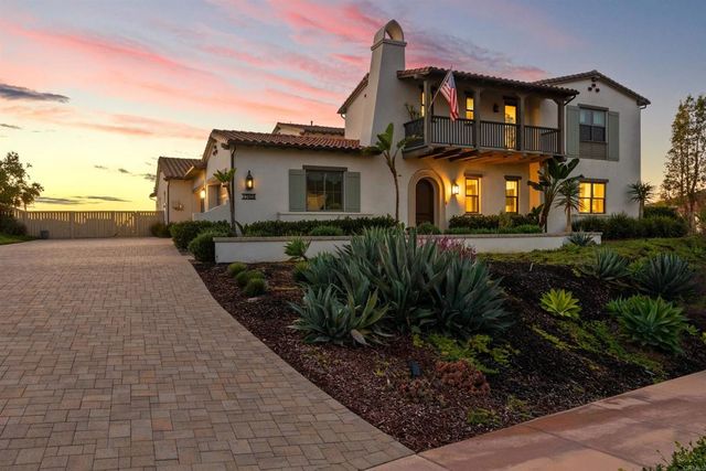 a building outdoor space with patio furniture and potted plants