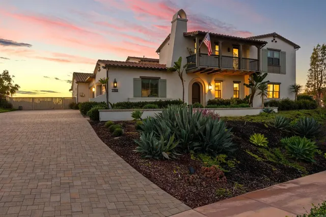 a building outdoor space with patio furniture and potted plants