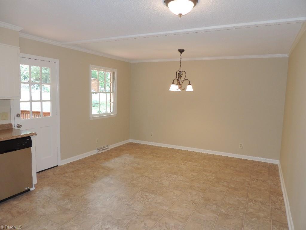 5309 Mapleton Street Clemmons, NC 27012 - Photo 12 of 19 Very spacious Dining Room! Convenient to the Kitchen and Deck!