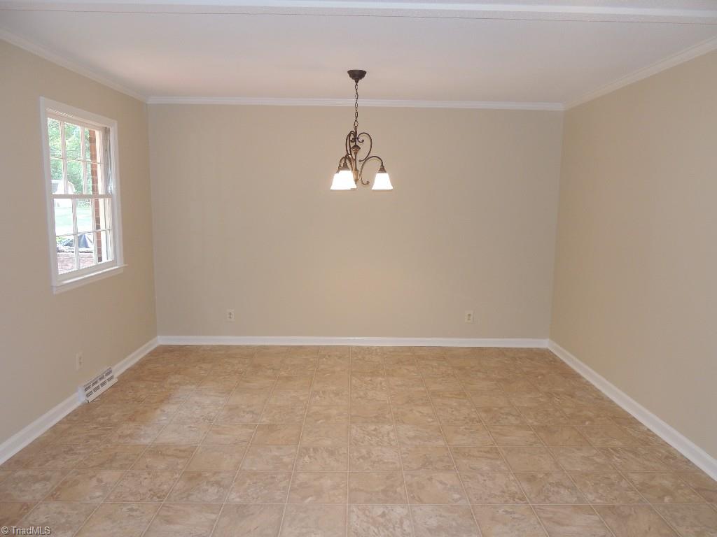 5309 Mapleton Street Clemmons, NC 27012 - Photo 13 of 19 Great view of the Dining room! More Crown Molding!