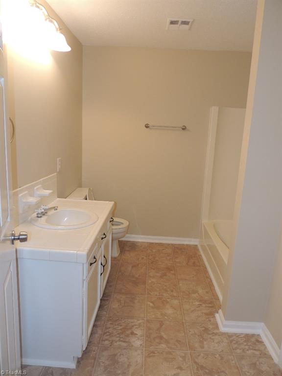 5309 Mapleton Street Clemmons, NC 27012 - Photo 15 of 19 Large Bathroom complete with Tiled vanity and a Tub!