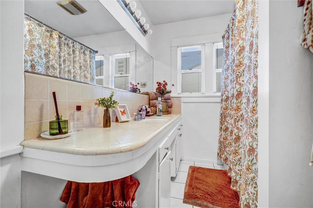 833 South Lemon Street Anaheim, CA 92805 - Photo 17 of 49 a bathroom with a sink and a mirror