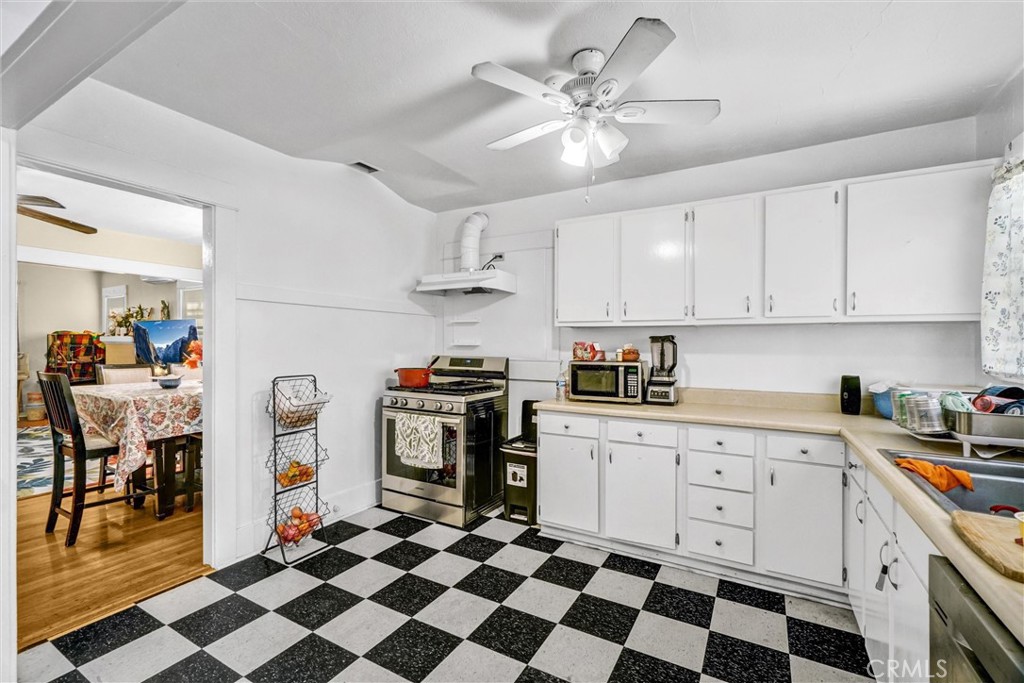 833 South Lemon Street Anaheim, CA 92805 - Photo 18 of 49 a kitchen with stainless steel appliances a stove a sink and a refrigerator