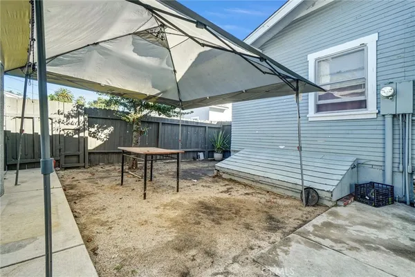 a view of a chairs and table in the patio