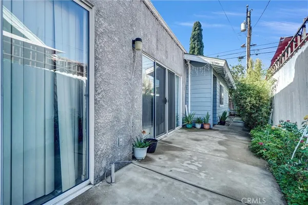 a view of a house with a backyard space and a street view