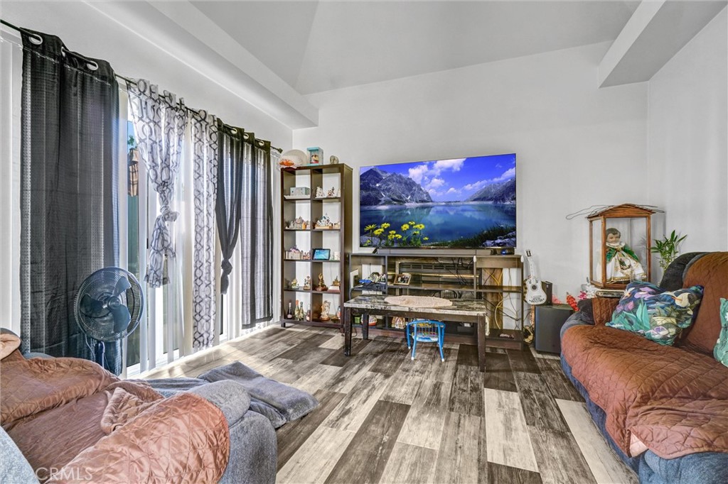 833 South Lemon Street Anaheim, CA 92805 - Photo 29 of 49 a bedroom with furniture and a flat screen tv